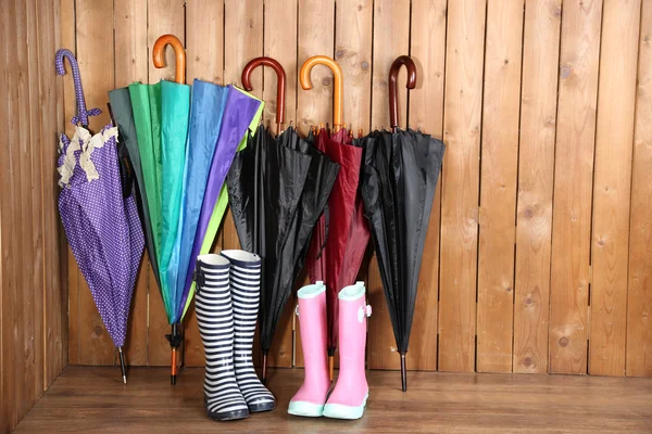 Umbrellas leaning over wall — Stock Photo, Image