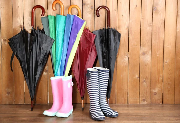 Umbrellas leaning over wall — Stock Photo, Image