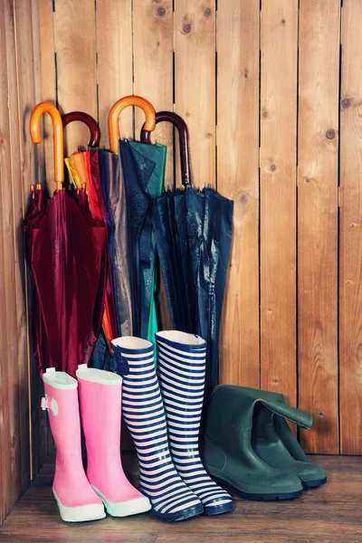 Umbrellas leaning over wall — Stock Photo, Image