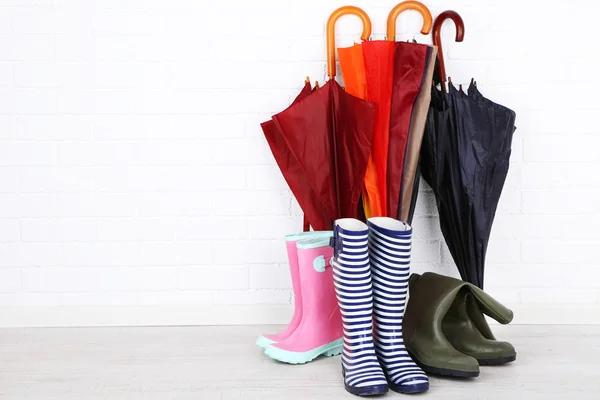 Bright umbrellas over wall — Stock Photo, Image