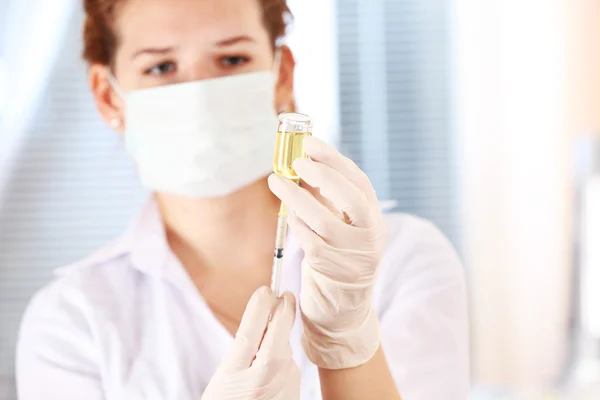 Doctor with medical syringe — Stock Photo, Image