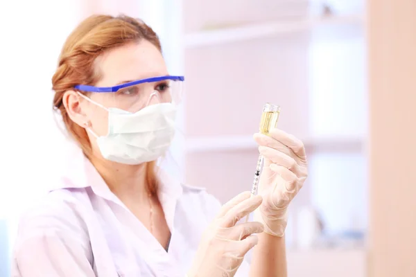 Doctor with medical syringe — Stock Photo, Image