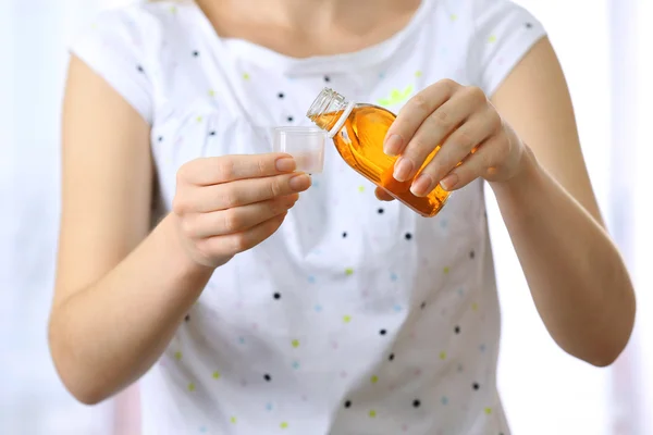 Female with Cough syrup — Stock Photo, Image