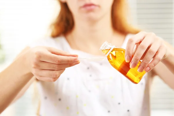 Female with Cough syrup — Stock Photo, Image