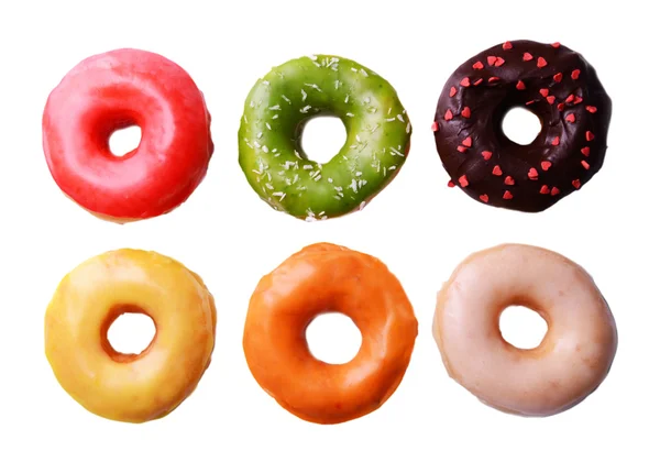 Delicious donuts with glaze isolated on white — Stock Photo, Image