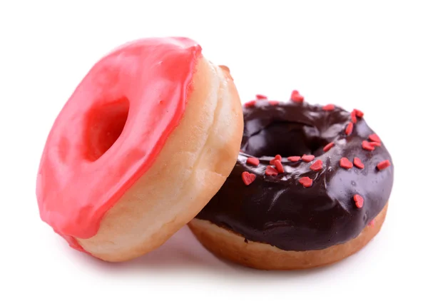 Deliciosas rosquillas con esmalte aislado en blanco —  Fotos de Stock