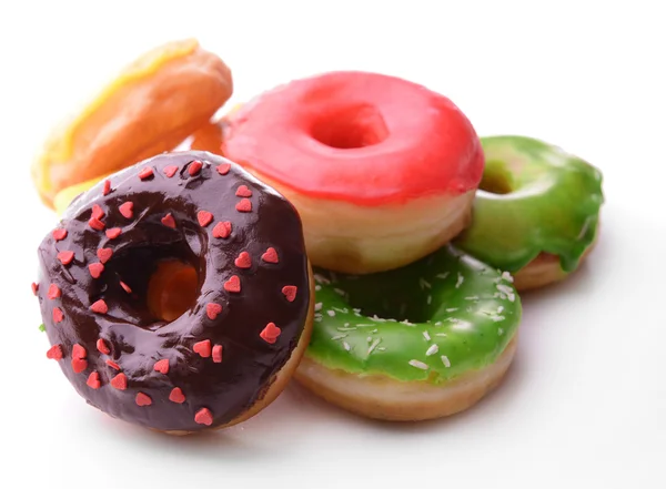 Delicious donuts with glaze isolated on white — Stock Photo, Image