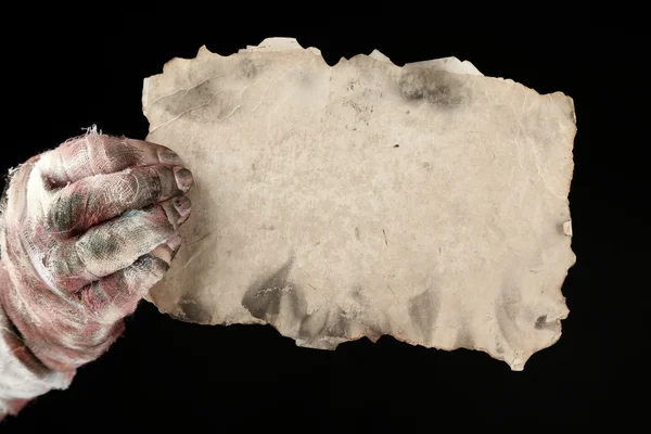 Hand of mummy with old paper — Stock Photo, Image