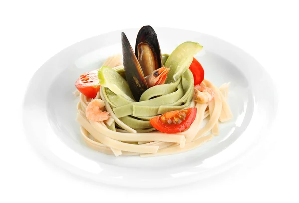 Tasty pasta with shrimps, mussels and tomatoes isolated on white — Stock Photo, Image