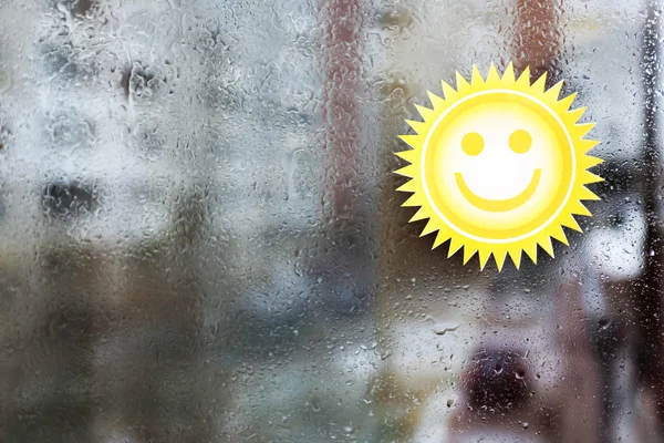 Sticker on wet window — Stock Photo, Image