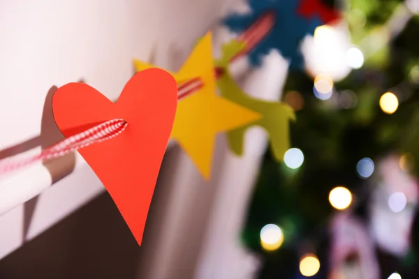 Christmas garland near fireplace — Stock Photo, Image