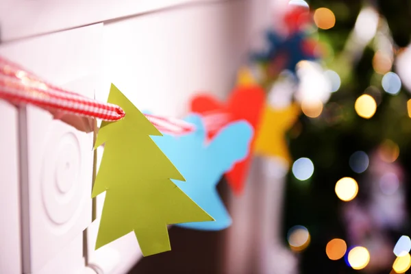 Christmas garland near fireplace — Stock Photo, Image