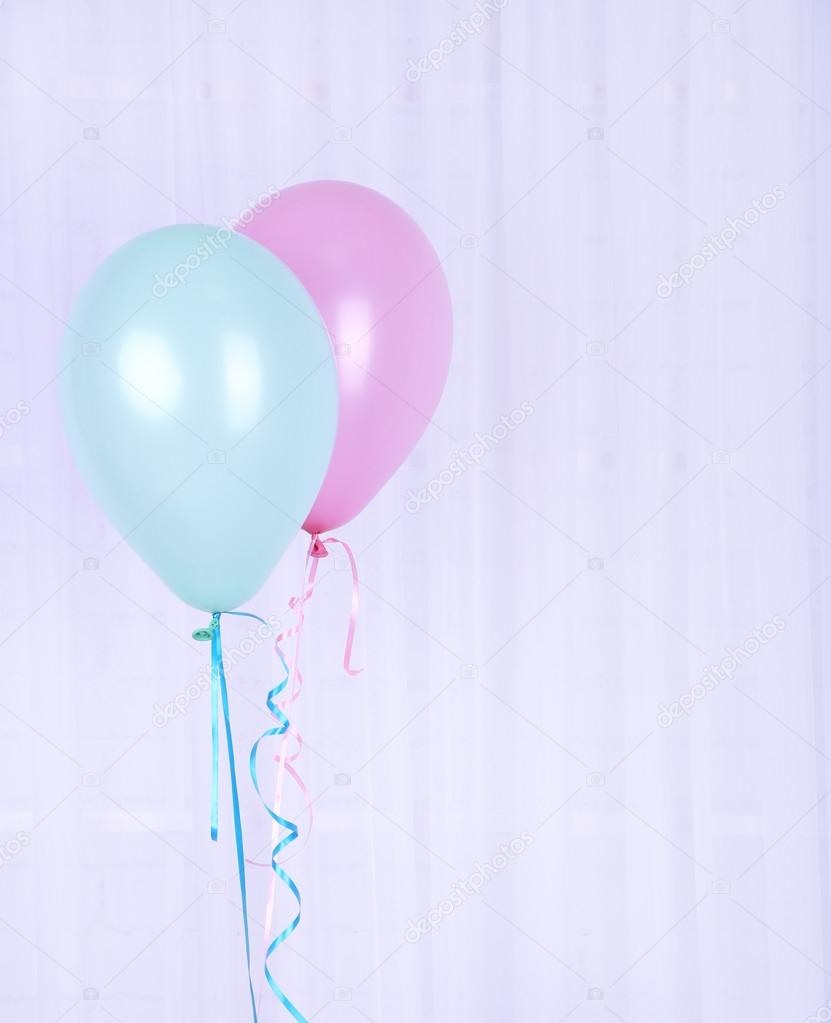 Hand holding balloons