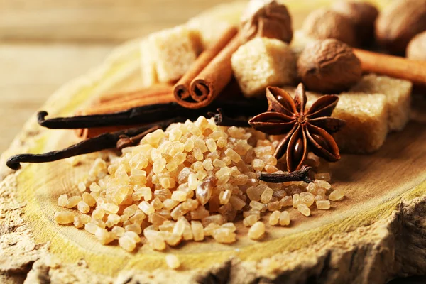 Christmas spices and baking ingredients on wooden background — Stock Photo, Image