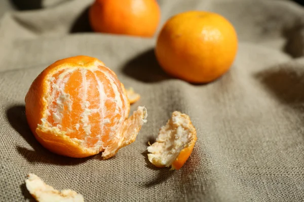 Juicy ripe tangerines on tablecloth — Stock Photo, Image