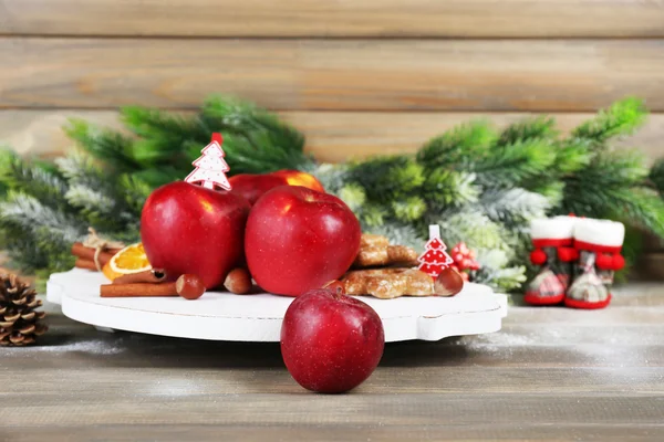 Christmas apples on wooden table — Stock Photo, Image