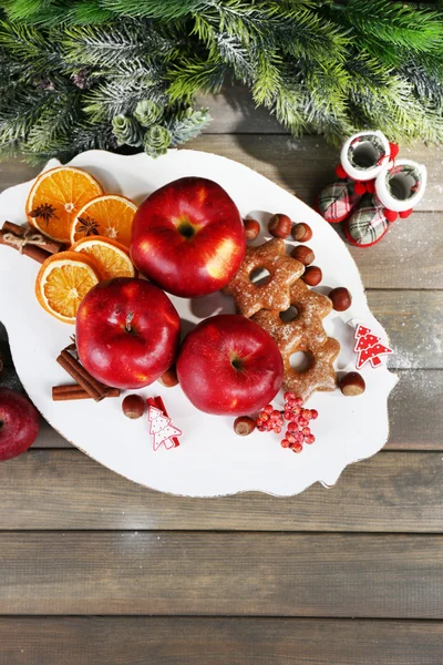 Christmas apples on wooden table — Stock Photo, Image