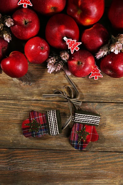 Christmas apples on wooden table — Stock Photo, Image