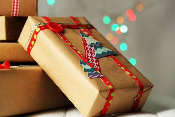 Hand-made Christmas gifts on bokeh background — Stock Photo, Image