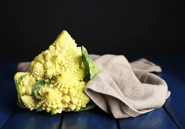 Romanesco broccoli on wooden table, on dark background — Stock Photo, Image