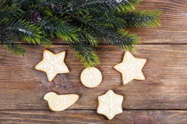 Gingerbread cookies with Christmas decoration on wooden table background — Stock Photo, Image