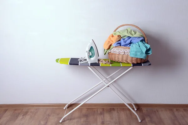 Ironing board with laundry — Stock Photo, Image