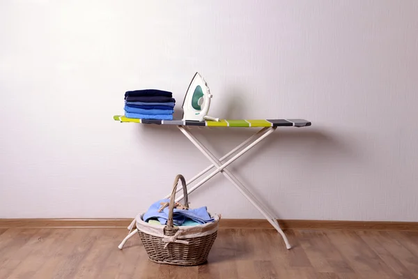 Ironing board with laundry — Stock Photo, Image