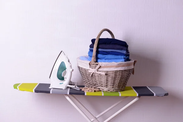 Ironing board with laundry — Stock Photo, Image