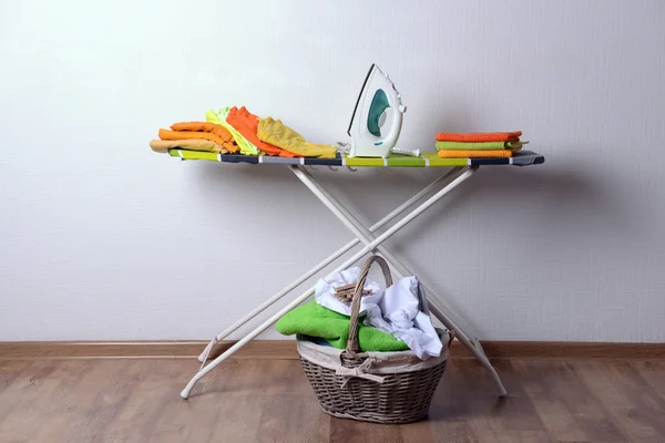 Ironing board with laundry — Stock Photo, Image