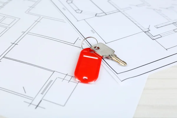 Key on house plan close-up — Stock Photo, Image