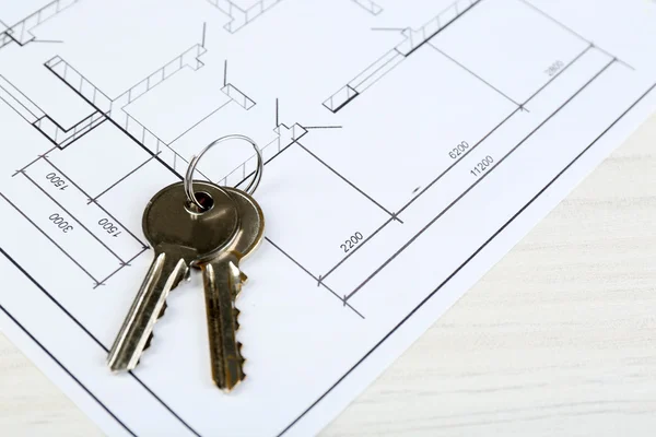 Key on house plan close-up — Stock Photo, Image