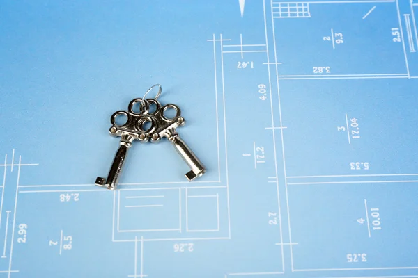 Key on house plan — Stock Photo, Image