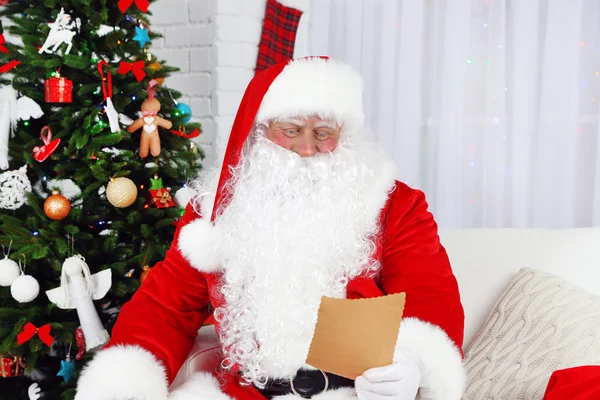 Santa Claus with list of presents — Stock Photo, Image