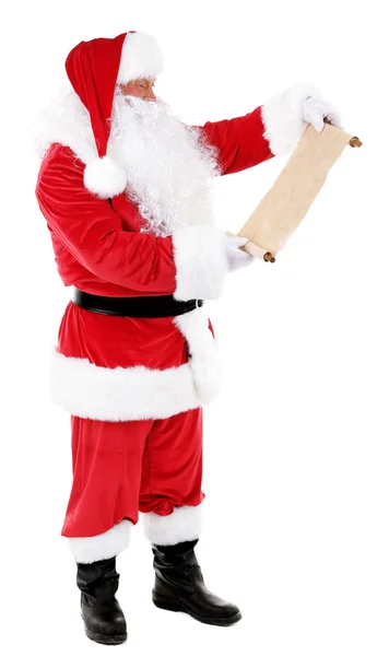 Санта-Клаус держит список желаний, изолированных на белом фоне — стоковое фото