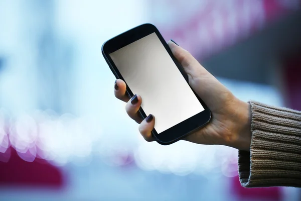 Mobile phone in woman hand — Stock Photo, Image