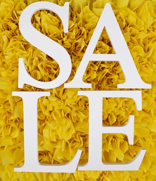 Продажа на желтом фоне — стоковое фото