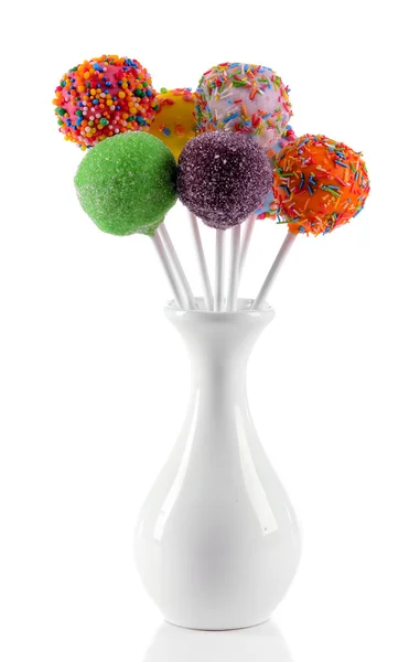 Sweet cake pops in vase isolated on white — Stock Photo, Image