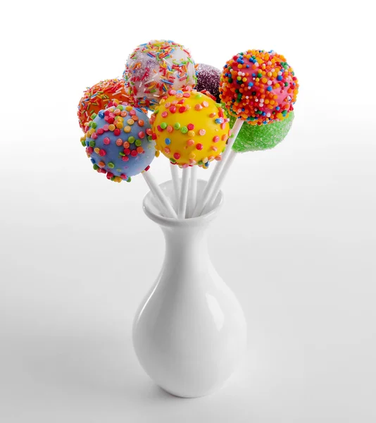 Sweet cake pops in vase isolated on white — Stock Photo, Image