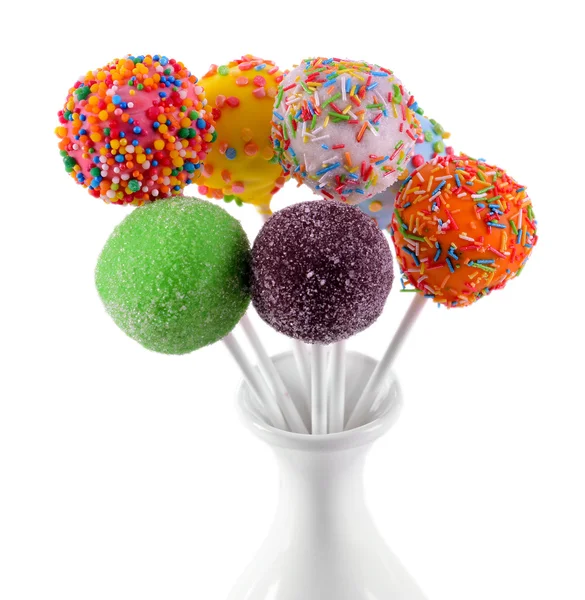 Sweet cake pops in vase isolated on white — Stock Photo, Image