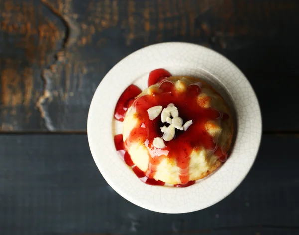 Delicious cheesecake on wooden table — Stock Photo, Image