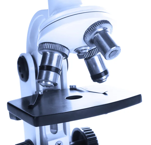Microscópio close-up, isolado em branco — Fotografia de Stock
