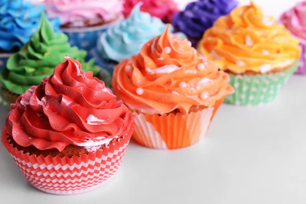 Delicious cupcakes on white background — Stock Photo, Image