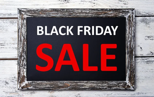 Vintage sign board with Black Friday Sale text on it on wooden background — Stock Photo, Image