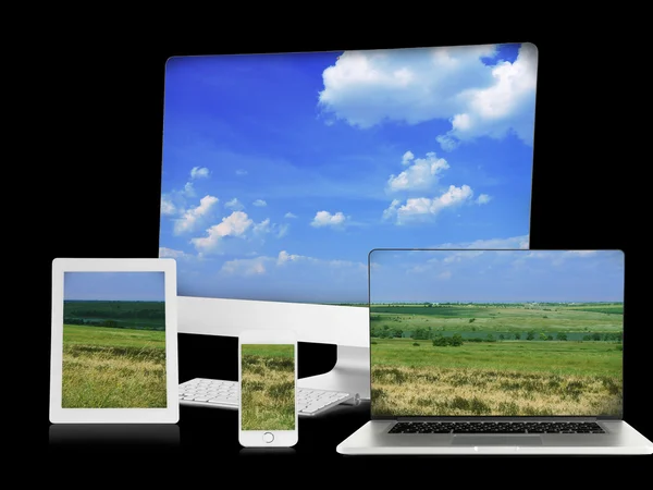 Monitor, laptop, tablets and phone with nature wallpaper — Stock Photo, Image