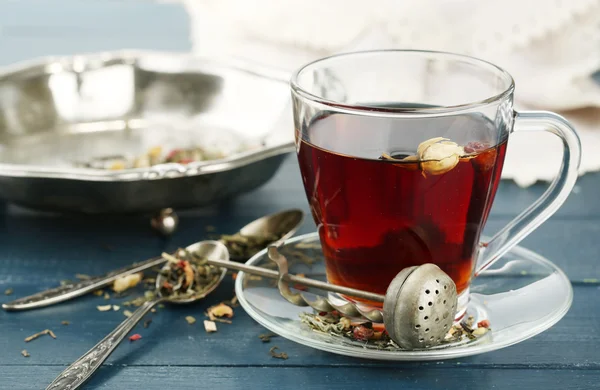 Beautiful vintage composition with herbal tea, on wooden table — Stock Photo, Image