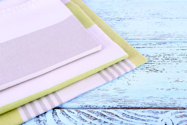 Colorful napkins on wooden table — Stock Photo, Image