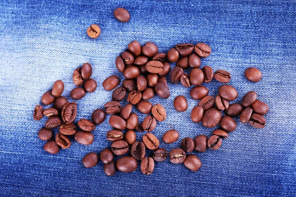 Coffee beans on the jeans background — Stock Photo, Image