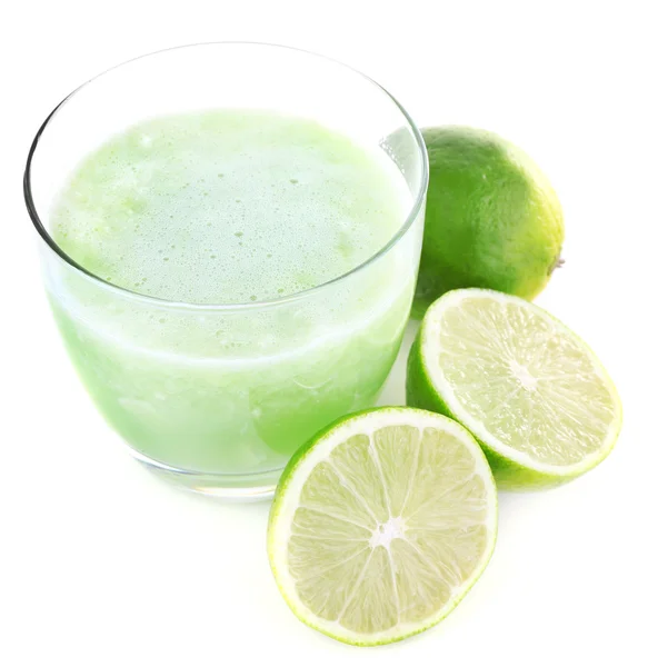 Glass of fresh lime juice with pieces of lime isolated on white — Stock Photo, Image