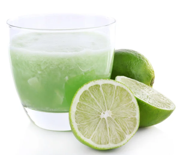 Glass of fresh lime juice with pieces of lime isolated on white — Stock Photo, Image