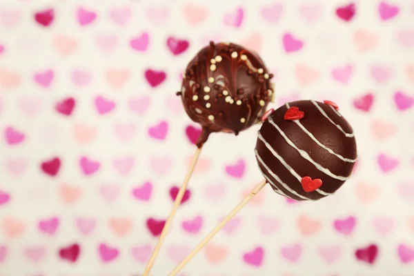 Tasty cake pops on color background — Stock Photo, Image